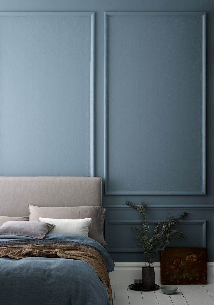 Bedroom in blue tones and minimalist decor