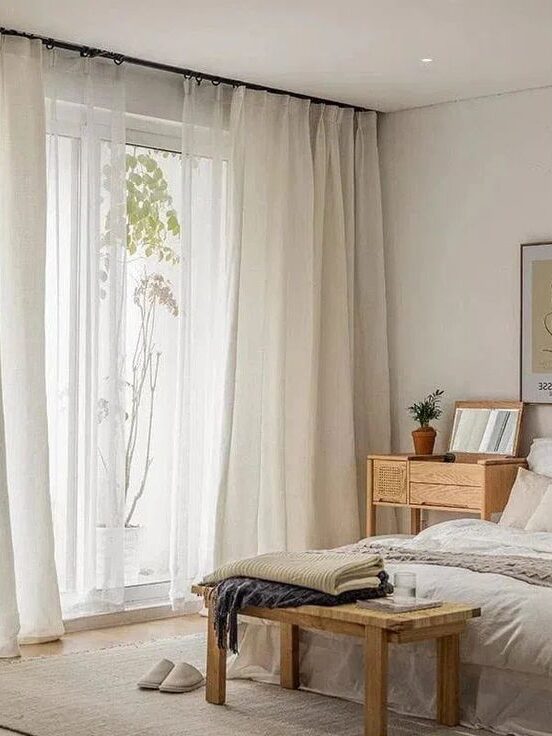 Transparent curtains on the windows for the bedroom